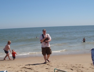 Daddy is walking me out of the ocean. It was totally weird.